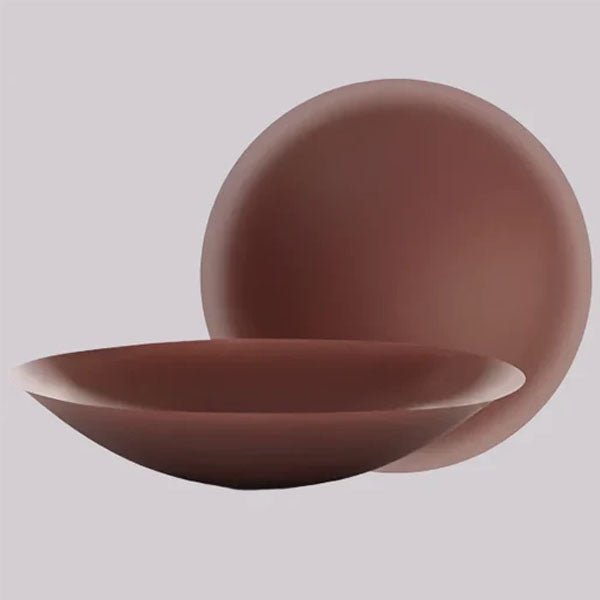 VRCÔMFY espresso brown adhesive petals with matte-finish texture, featuring a domed silhouette and complementary concave curvature | Velvety matte surface and anatomical design for seamless second-skin adherence against minimalist slate backdrop