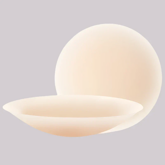 VRCÔMFY adhesive petals in soft beige showcasing 3D dome shape and concave curvature | Anatomical design with cloud-like softness for natural contouring and discreet coverage